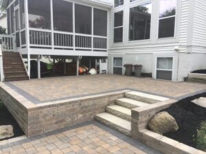 Unilock Paver Patio Retaining Wall Steps Landscape Lighting Backyard